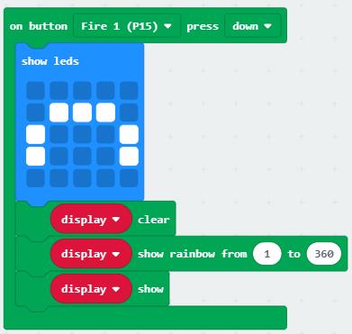 A Tűz 2 gomb hatására jelenítsünk meg a micro:bit kijelzőjén egy vigyorgó fejet.