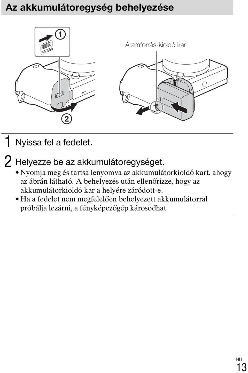 Nyomja meg és tartsa lenyomva az akkumulátorkioldó kart, ahogy az ábrán látható.