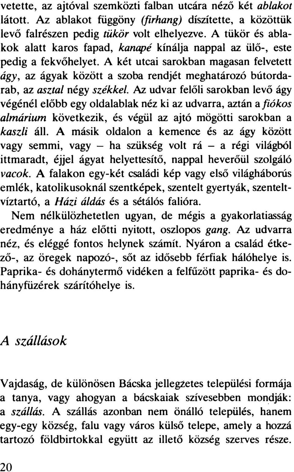 A két utcai sarokban magasan felvetett ágy, az ágyak között a szoba rendjét meghatározó bútordarab, az asztal négy székkel.