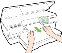 b. Ha papír maradt a nyomtatóban, ellenőrizze, hogy a patrontartó a nyomtató jobb oldalán található-e, távolítsa el az összes papírdarabkát és gyűrött papírt, majd húzza maga felé a papírt a