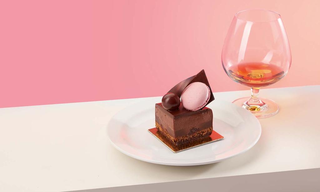 Emil Gerbeaud s Legacy and HENNESSY FINE COGNAC Chocolate dessert speciality flavored with homemade cognac cherries, served with vanilla ice cream, garnished with a classic cat s tongue chocolate.