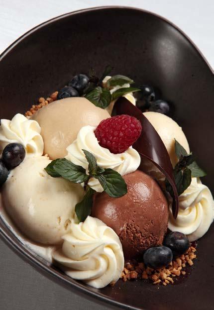 ICE CREAM SUNDAES / FAGYLALTKELYHEK New York ice cream sundae 1 scoop of coffee ice cream, 1 scoop of vanilla ice cream, 1 scoop of chocolate ice cream and 1 scoop of hazelnut ice cream with