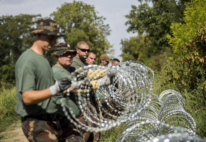 (NATO standards) barbed wire to achieve the desired result. In addition, under the command of police forces, units of the Hungarian Defence Forces started also to patrol together with the police.