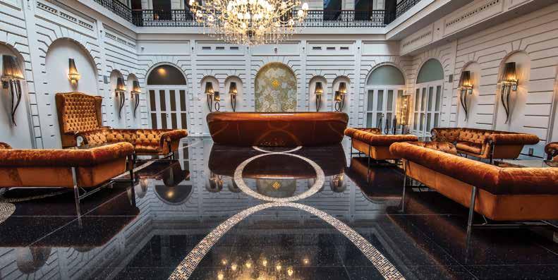 The rooms are dominated by IPE Cavalli furniture, Masiero Luxury chandelier decorated with Swarovski crystals, handpainted English silk wallpaper, with a floor covering strewn with bronze grains and