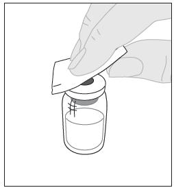4. Törölje le az injekciós üveg tetejét a csomagban mellékelt alkoholos törlők (F) egyikével, és hagyja a levegőn megszáradni.