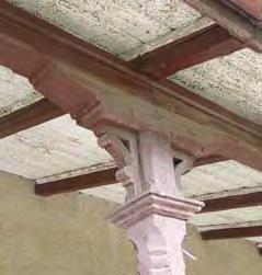 Staničná budova, detail rezbársky dekorovanej konštrukcie prestrešenia nástupiska vrchným vedením stavby Ing. Ľudovít Tollnay. Stavba sa realizovala od 1.novebmra 1891 do konca októbra 1892, 7.