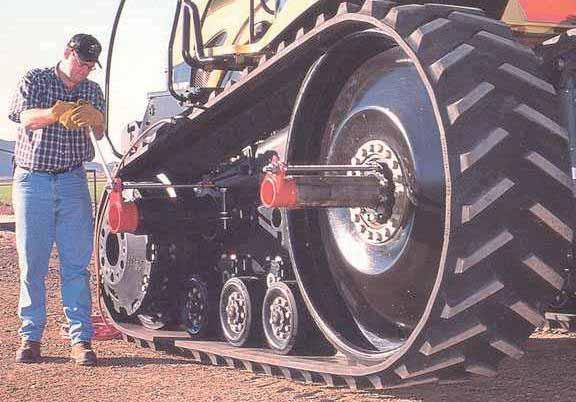 tási lehetőséggel is rendelkezik. Az 5. kép példaképen a Challenger sorközművelő gumihevederes traktor nyomtávállítását mutatja be. Gumihevederes traktorok kormányzása 5.