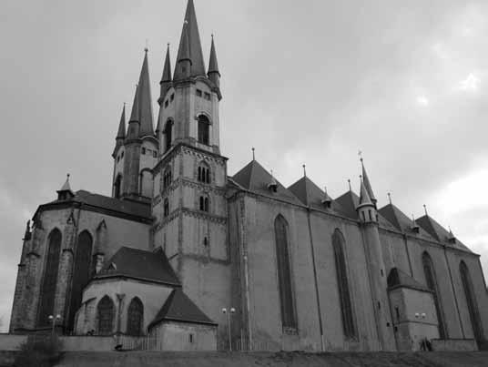 strana 22 dovického kláštora spred roka 1209. Veža Kaplanka v stredovekých hradbách mesta Nymburk vybudovaných za vlády Otakara II. Přemysla a jeho syna Václava II.