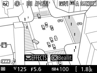 ( Miniatűr hatás 1 Válassza az élő nézetet. Nyomja meg az a gombot. Az objektíven át látható kép megjelenik a monitoron. a gomb 2 Helyezze el az élességpontot.