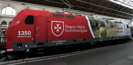 4 Máltai Hírek :: 2016 :: Június aktuális Máltai üzenetek egy mozdony oldalán A Magyar Máltai Szeretetszolgálat üzeneteit megjelenítô mozdonyt helyezett forgalomba a MÁV.