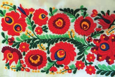 Women wore the white small kodmon with colourful embroidery, kuzsu.