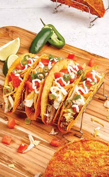 SZUPER NACHO TACOS SZUPER NACHO TACOS 8 adag 8 kemény taco kagyló (ropogós kukorica tortillák, késztermék) ½ csésze méz 1 csomag taco fűszer 1 csomag sajtpor (vagy nagyon finoman reszelt sajt) 350 g