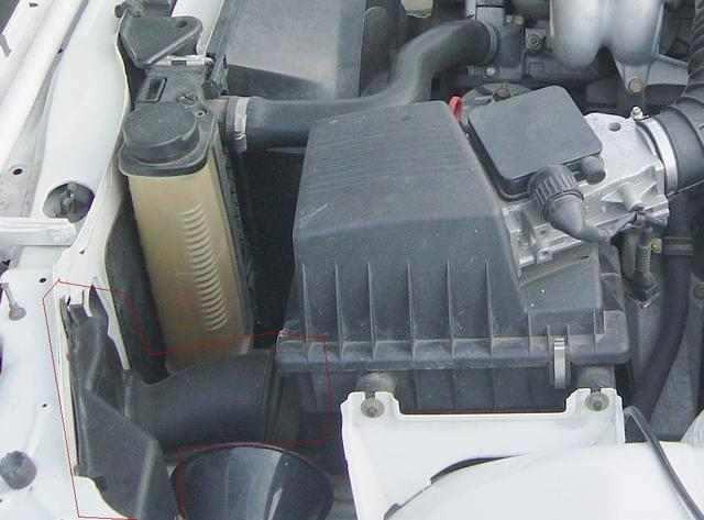 frame (9). After the filter house the air enters into the AFM, and then it goes through a rubber boot which connects this system to the intake manifold of the engine.