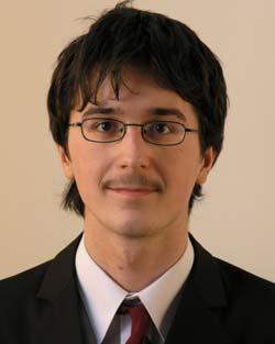2001-ben az Arany Dániel Matematikai Versenyen dicséretet kapott, majd abban az évben, amikor megtanulta a "latex" és a "html" nyelveket, valamint a "php" webes programozási nyelvet, és mindezek