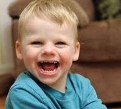 of frequent laughter/smiling; apparent happy demeanor; easily excitable personality, often with hand flapping movements;