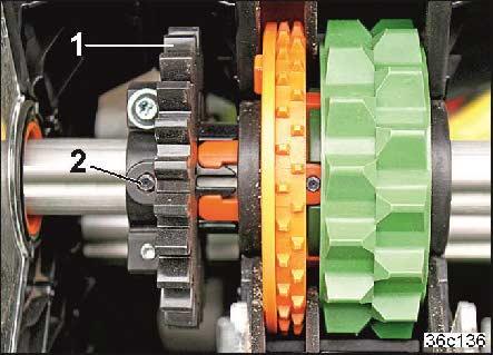 Karbantartás és helyreállítás 12.5.2.6 A művelőút-adagolókerék átszerelése adagolókerékre Az előtéttengely fogaskerekei hajtják meg a művelőút-adagolókerekeket.
