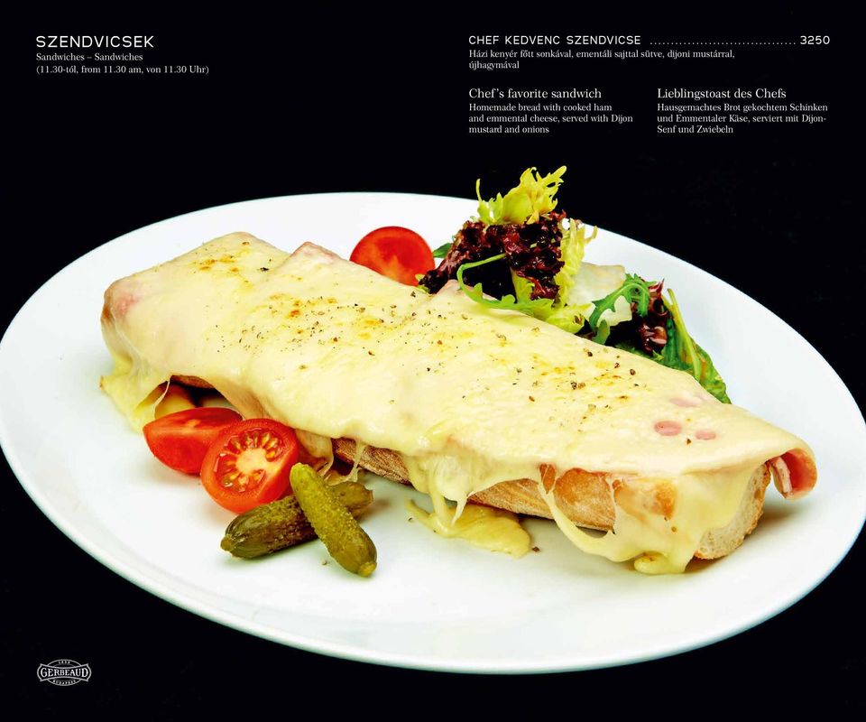 sandwich Homemade bread with cooked ham and emmental cheese, served with Dijon mustard and onions