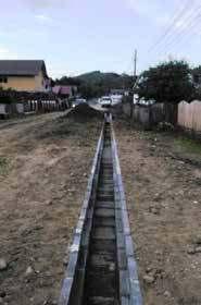 Lucrările de reabilitare a DJ 115 Fetești - Gura Văii constau în balastarea întregului drum, turnarea mai multor straturi de asfalt, realizarea de