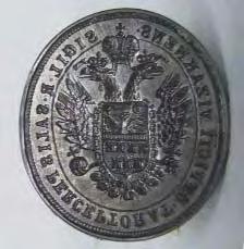 234. Tipar sigilar. Ocna Sibiului. Fontã. D : 34 x 30 mm, H: 53 mm. Sec. XIX. În câmpul sigilar acvila bicefalã imperialã încãrcatã cu un scut tãiat, cu armele Transilvaniei (pozitiv).