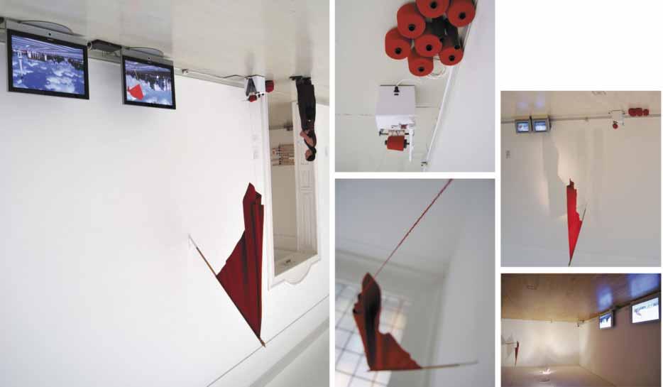 5 utopia battery > 2008 installation: two channel video (two monitors), knitted red flag, motion sensor, mechanism In the presence of the viewer the motion sensor turns on the mechanism which