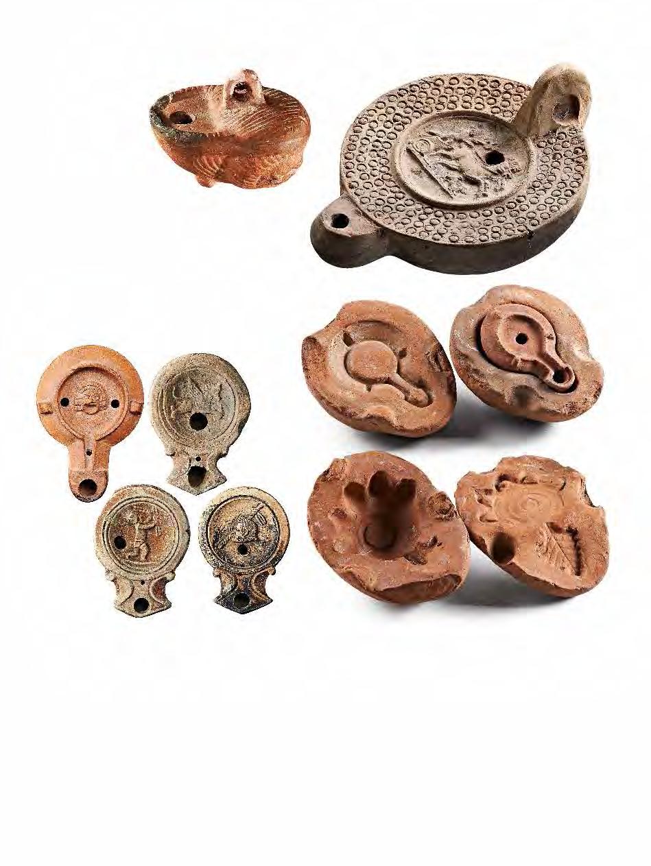 : 11 cm; M.: 5,5 cm SM Szombathely, 54.775.30 31; 63.4.101, 63.4.105. RÓMAIAK 23 V.50 Bronzmécses Iuppiter büsztjével 1. sz. Mór H.: 30 cm; Sz.: 20 cm MNM Budapest, 78/1913. V.52 Négerfejes bronzmécses 2.