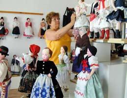 Folk Costume Doll Museum Abádszalók, lying on the shore of Lake Tisza, is famous for the permanent exhibition in the country which displays the richest collection of folk costumes from the Hungarian