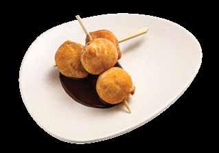 Crispy tortilla rolls with mango puree and