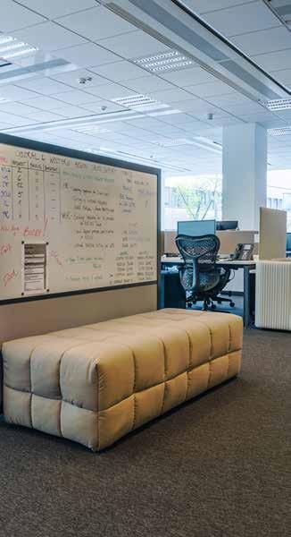 OFFICE MARKET furnish collaborative spaces and separate zones, e.g. high-backed acoustic sofas and armchairs enclosed from three sides.