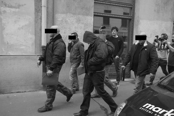 taking photos of individuals leaving
