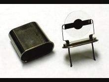 The resonator crystals were sealed to the side of a glass vessel. The working electrode was polarized using a Pt sheet, area = 6.