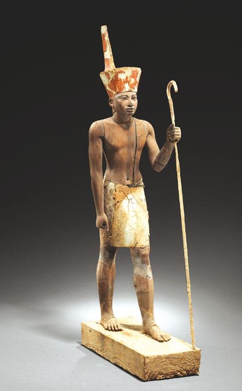 5. KÖZÉPBIRODALOM (Kr. e. 2055 1650) 77 73b. kép. A XII. dinasztián belüli stílusátmenet reprezentánsa: II. Amenemhat arcvonásait viselő festett fa őrszobor.