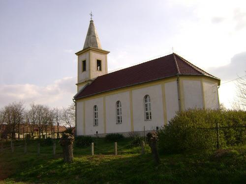 Mórichida határában, Dombiföldön található az Árpád-korban -1251. előtt- román stílusban, a mórichidai premontrei kolostor részeként épült katolikus templom.