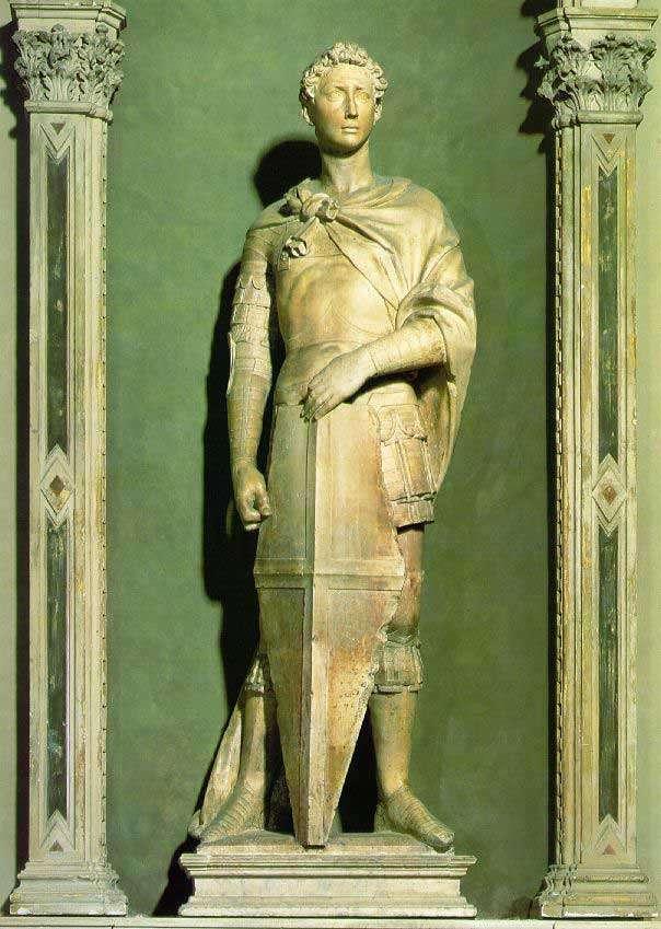 Donatello - Szent György 1416 Szent Györgyöt Donatello ifjú hősként, klasszikus páncélzatban ábrázolja, kezében a földön megtámasztott pajzsot tart.