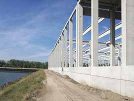 A csarnok homlokzatán 876 fm hőszigetelt lábazati panel került elhelyezésre, nagyrészt 2 sorban az épület hosszú homlokzatain. Összesen a projektre kiszállított vasbetonelem súlya 6200 t.
