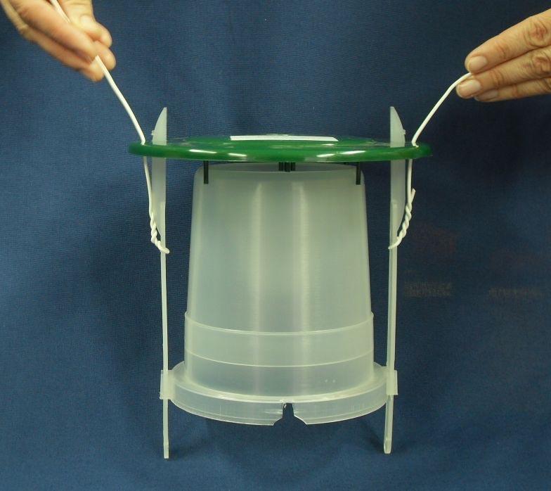 Put the roof above the funnel opening and push it down along the