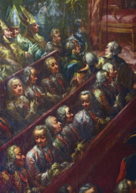 könyvből. A mellette álló egri püspök könyvet és körmeneti kettős keresztet tart a kezében, mivel a templomba történő bevonuláskor a menet élén haladva ő vitte az apostoli keresztet.