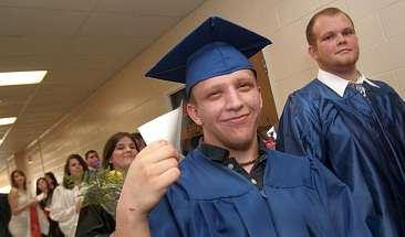 John Sitnick, Dehi-Jaquan Martin waits with his classmates in the hallway of the school. David Buranich keeps his cool with the help of an index card.