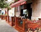 A borbár rusztikus belső tere harmonizál az étterem, a Trattoria Toscana enteriőrével, s innen érkeznek a borkorcsolyák is: hamisítatlan olasz csipegetnivalók, sonkák, kolbászok, szalámik hogy csak