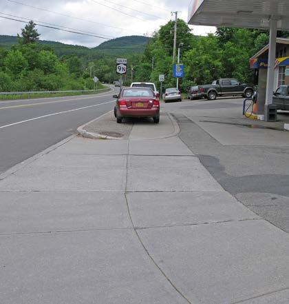 Moderate High # of Curb Cuts: 0 Residential 2 Non-residential Density of Curb Cuts: 12 per mile Notes: This segment of sidewalk ends mid-block across from the library.