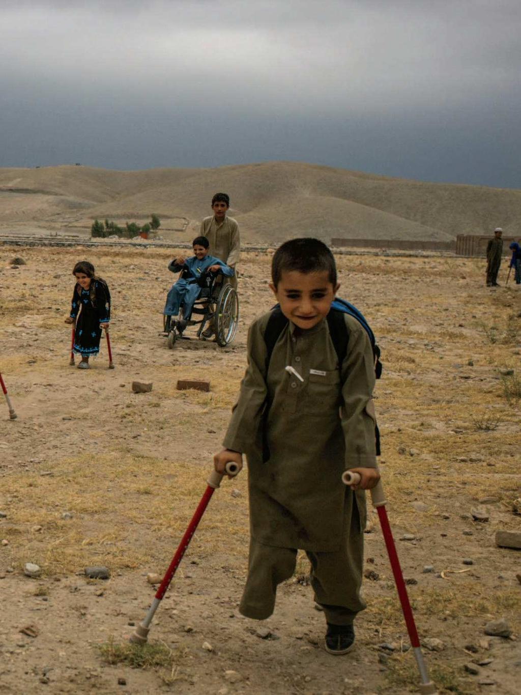 From left: Bashir, Mangal, Marwa, Abdul Rashid (in wheelchair), Aman and, in the distance, Rabia